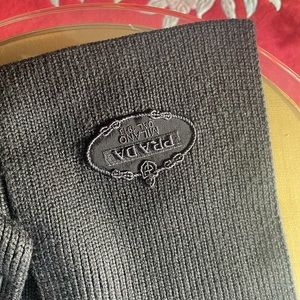 Prada black wool scarf , not new , check picture carefully please .